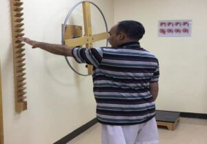 Active-assisted shoulder flexion and extension range of motion exercise with the use of the ladder